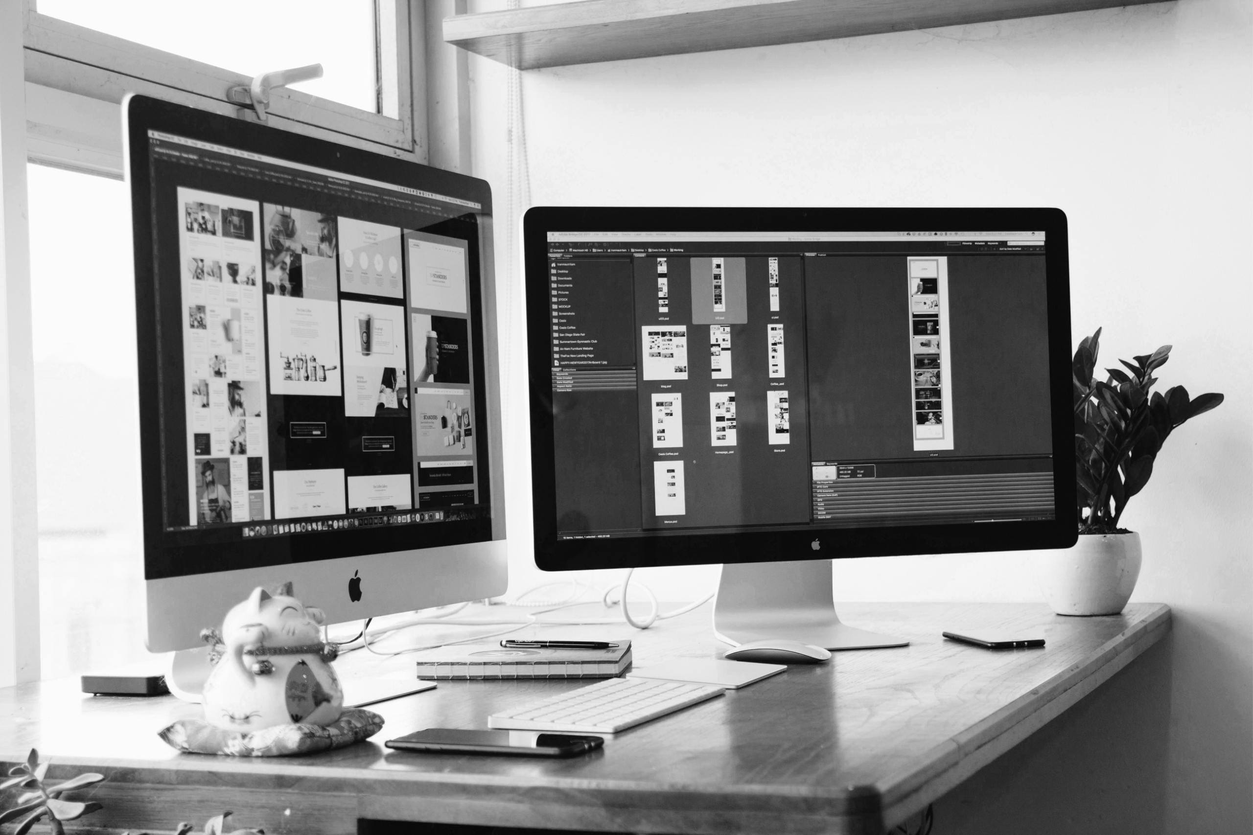 Creative work displayed across two desktop monitors